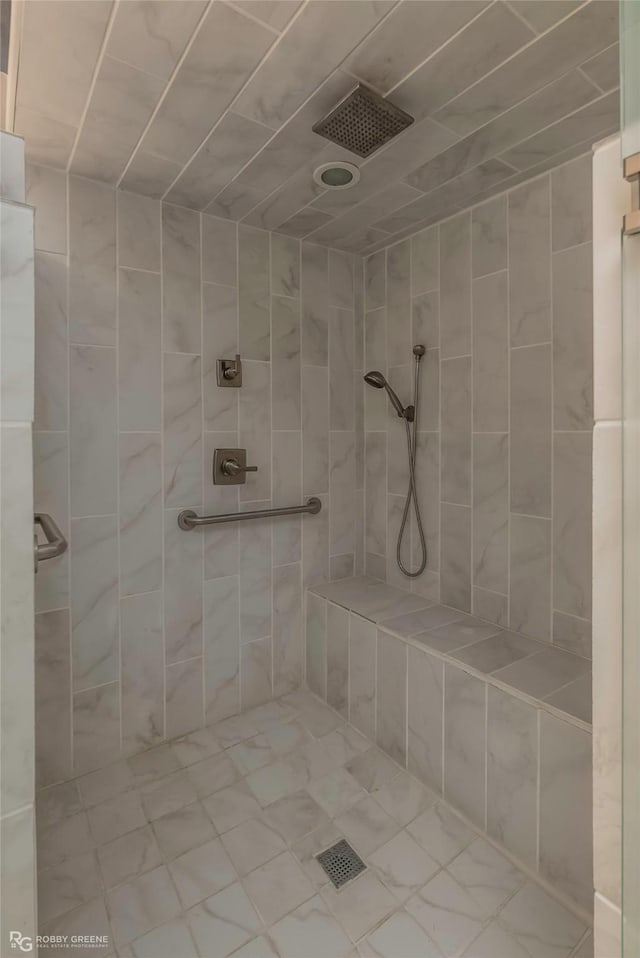 bathroom with a tile shower