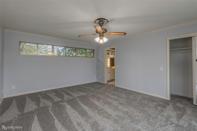 unfurnished bedroom featuring carpet flooring, baseboards, and ornamental molding