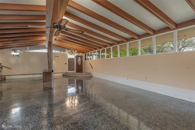 interior space with granite finish floor, baseboards, vaulted ceiling with beams, and ceiling fan with notable chandelier