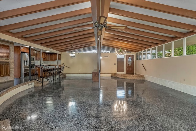 interior space featuring beam ceiling, stainless steel appliances, baseboards, and a ceiling fan