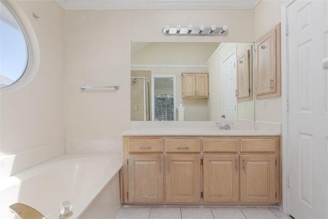 bathroom featuring vanity, a stall shower, ornamental molding, tile patterned flooring, and a bath