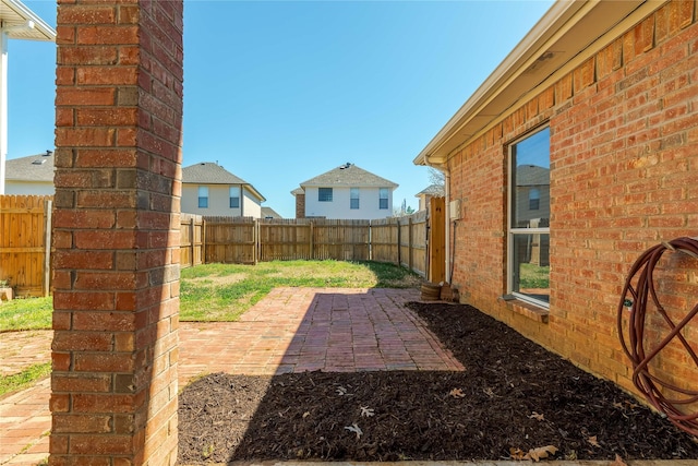 view of yard featuring a fenced backyard and a patio area