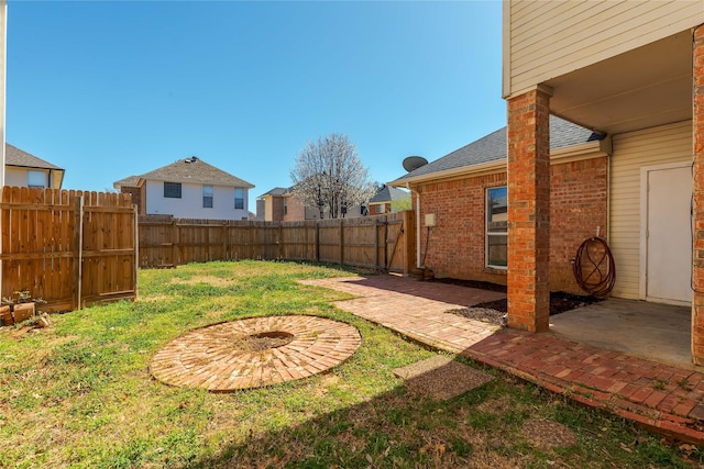 view of yard featuring a patio and a fenced backyard