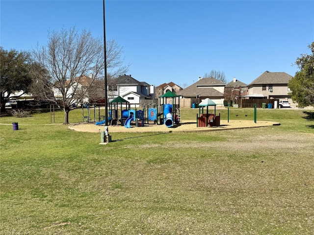 community play area with a residential view and a yard