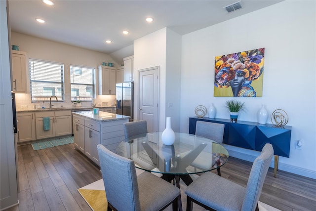 dining room with dark wood-type flooring, recessed lighting, and visible vents