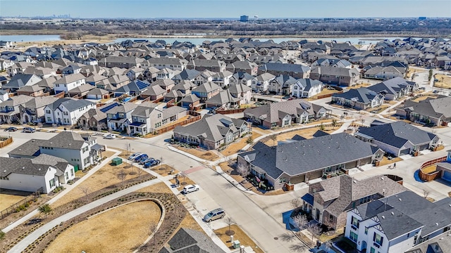 bird's eye view featuring a residential view and a water view