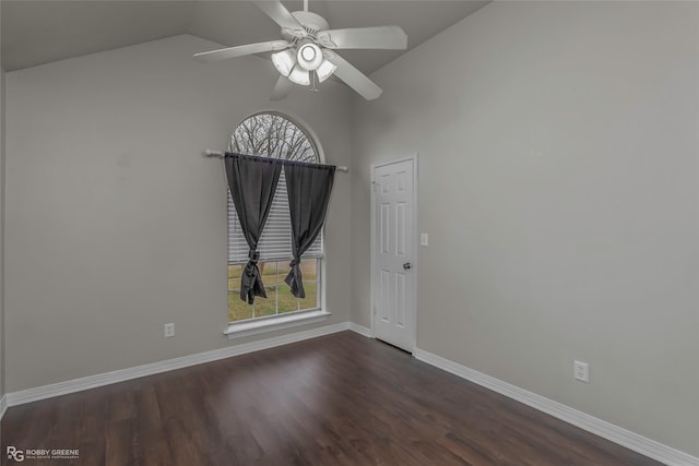 spare room with a wealth of natural light, baseboards, dark wood-style floors, and ceiling fan