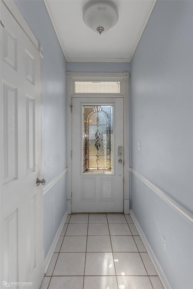 doorway to outside featuring light tile patterned floors, baseboards, and ornamental molding