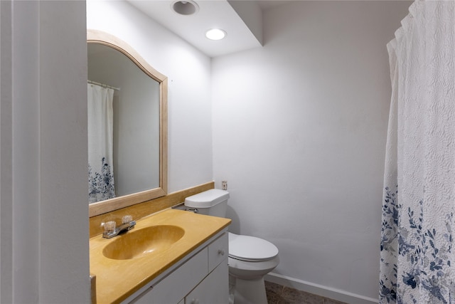 1306 N Floyd Rd, Richardson, TX 75080 - full bathroom with toilet, vanity, and tile patterned flooring