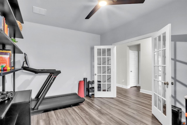 workout room with visible vents, baseboards, ceiling fan, french doors, and wood finished floors