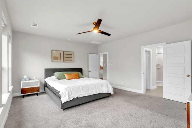 carpeted bedroom featuring visible vents, baseboards, and ceiling fan