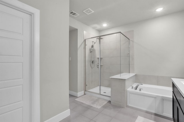 bathroom featuring tile patterned floors, visible vents, a garden tub, and a stall shower