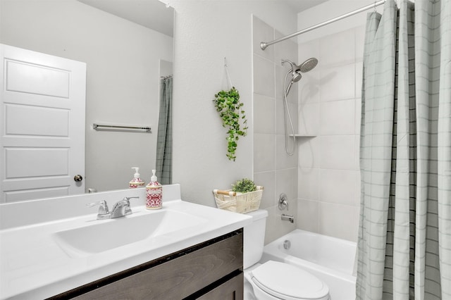 bathroom with shower / tub combo, toilet, and vanity