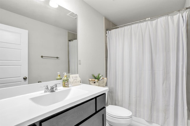 full bath featuring visible vents, toilet, and vanity