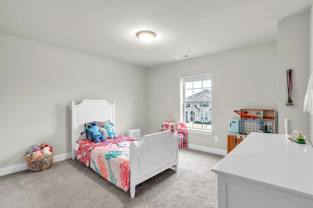 bedroom featuring light carpet, visible vents, and baseboards