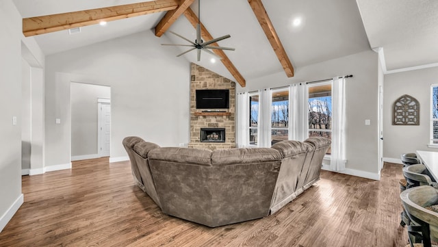 living room with a stone fireplace, beamed ceiling, high vaulted ceiling, and wood finished floors