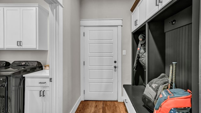 mudroom featuring light wood-style flooring and baseboards