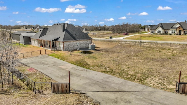 view of yard featuring a residential view and fence