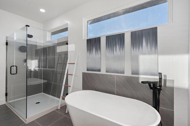 20055 Hill Ln, Kemp, TX 75143 - full bath featuring a freestanding tub, a shower stall, recessed lighting, tile patterned floors, and tile walls