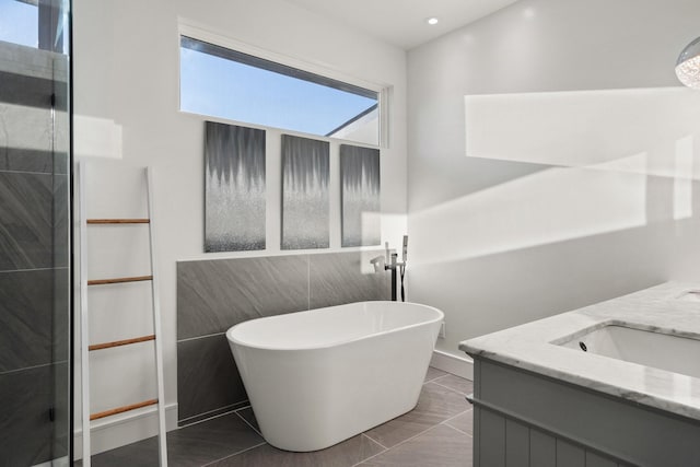 20055 Hill Ln, Kemp, TX 75143 - bathroom with double vanity, a freestanding bath, and recessed lighting