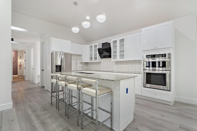 20055 Hill Ln, Kemp, TX 75143 - kitchen with stainless steel appliances, a sink, exhaust hood, backsplash, and a center island with sink
