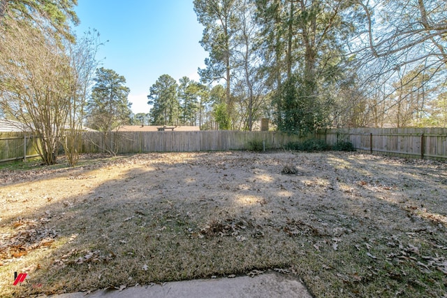 view of yard with a fenced backyard