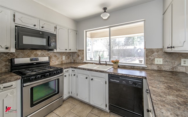 kitchen featuring a sink, backsplash, black appliances, and white cabinetry