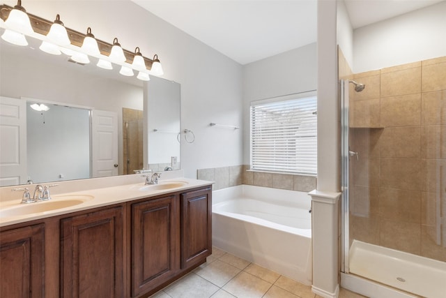 full bath featuring tile patterned flooring, a shower stall, a bath, and a sink