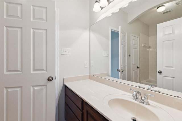 full bathroom featuring visible vents, vanity, and  shower combination