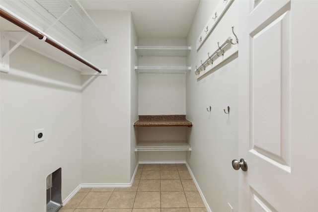 spacious closet featuring light tile patterned floors