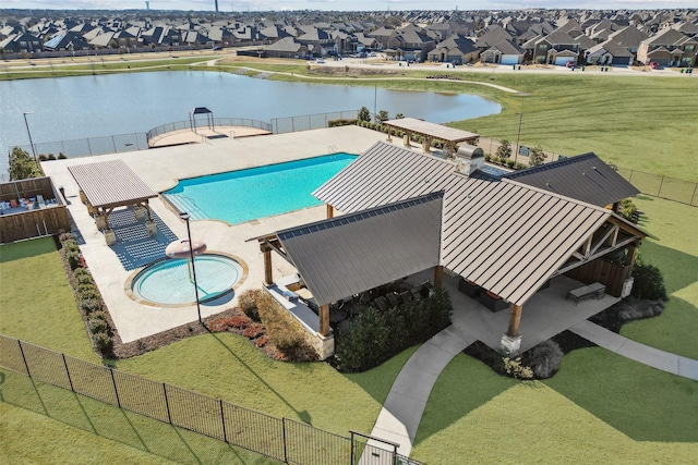 community pool featuring a patio area, a residential view, and fence private yard