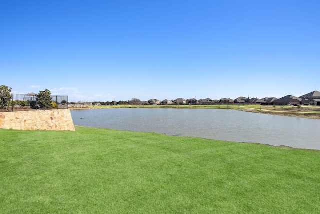 view of water feature with fence