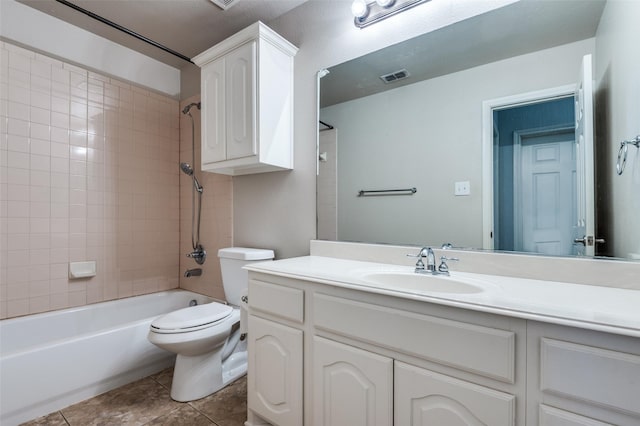 bathroom featuring visible vents, toilet, shower / washtub combination, tile patterned flooring, and vanity