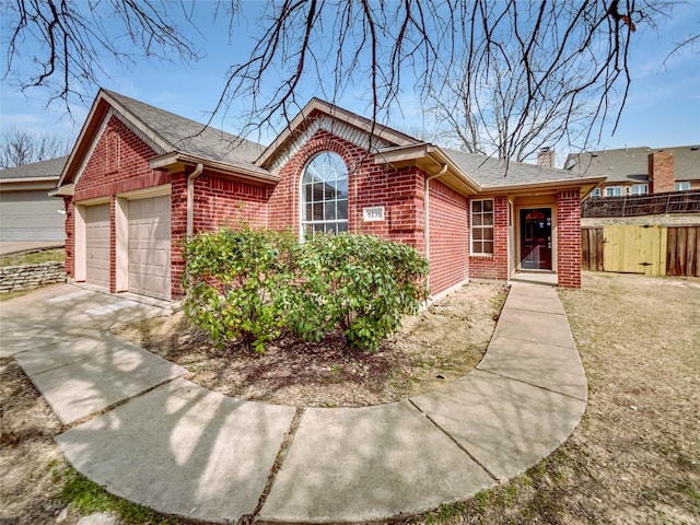 single story home featuring brick siding, roof with shingles, a chimney, and fence