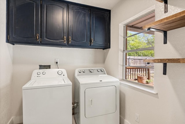 laundry room featuring cabinet space, washer and clothes dryer, and baseboards