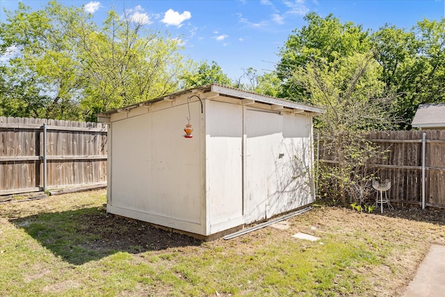 view of shed with a fenced backyard