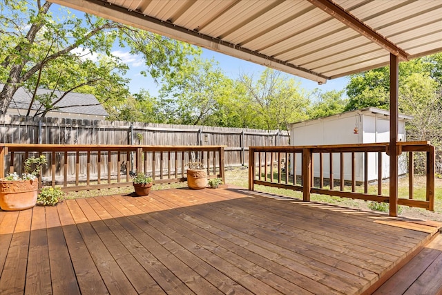 deck with a fenced backyard