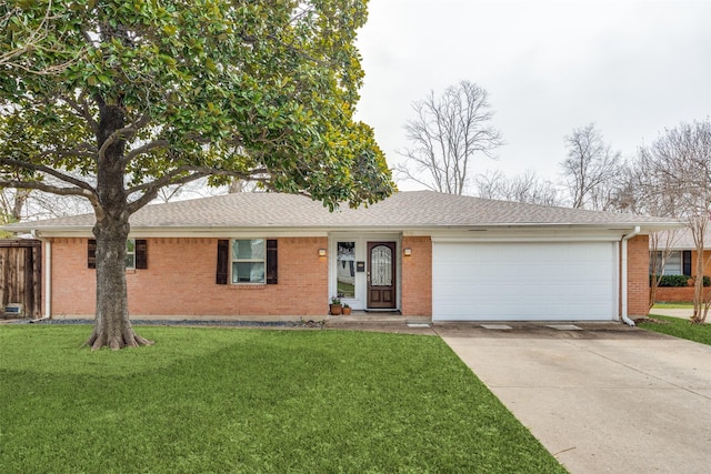 ranch-style house featuring brick siding, a front lawn, concrete driveway, roof with shingles, and a garage