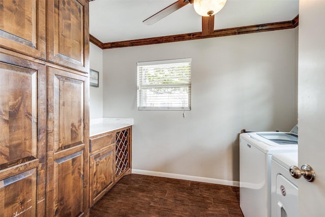 laundry room with washing machine and clothes dryer, baseboards, dark wood finished floors, ornamental molding, and cabinet space