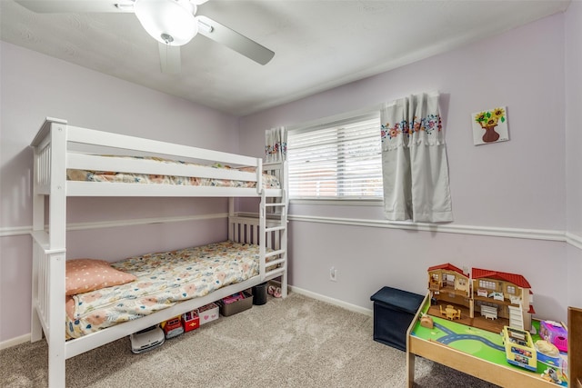 bedroom featuring ceiling fan, baseboards, and carpet