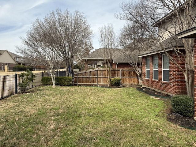 view of yard featuring a fenced backyard