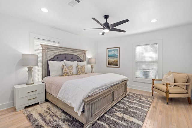 bedroom with recessed lighting, visible vents, and light wood-style flooring