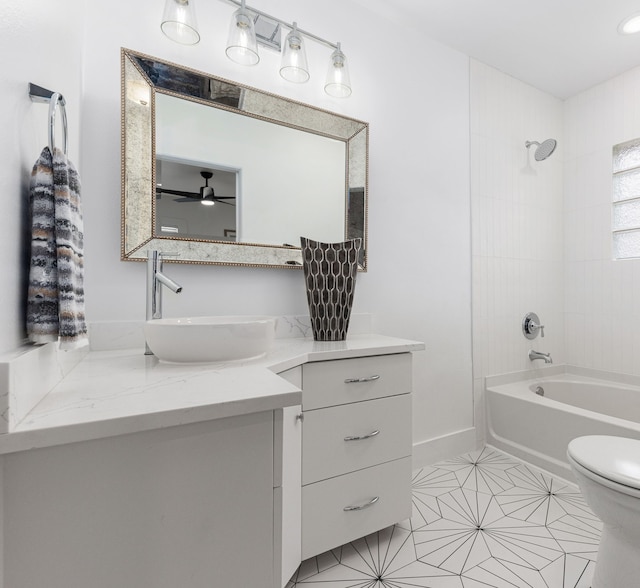 full bathroom featuring shower / bath combination, baseboards, toilet, and vanity