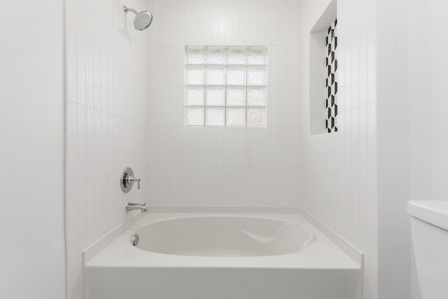 bathroom with toilet and shower / washtub combination