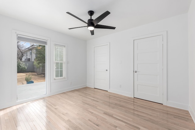 unfurnished bedroom with access to exterior, a ceiling fan, light wood-type flooring, and baseboards