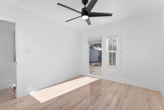 empty room with light wood-style flooring, baseboards, and ceiling fan