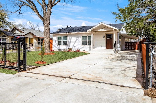 single story home featuring a fenced front yard, concrete driveway, a front yard, and a gate