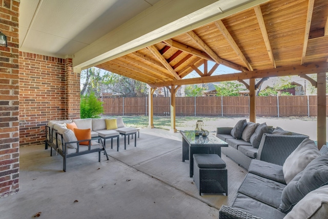 view of patio / terrace featuring an outdoor living space and a fenced backyard