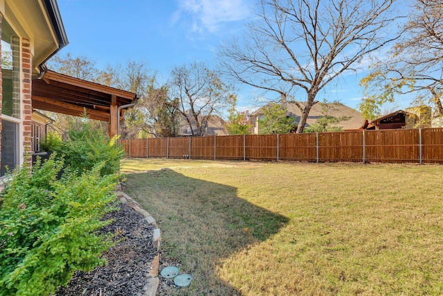 view of yard featuring a fenced backyard