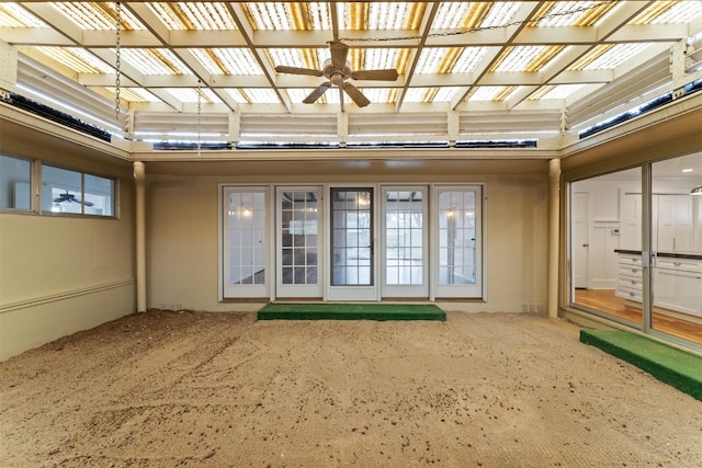 view of exterior entry with a patio area, a pergola, and stucco siding